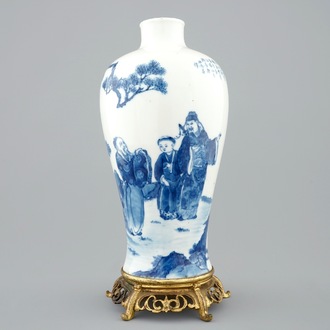 A Chinese blue and white meiping vase on gilt bronze stand, 19th C.